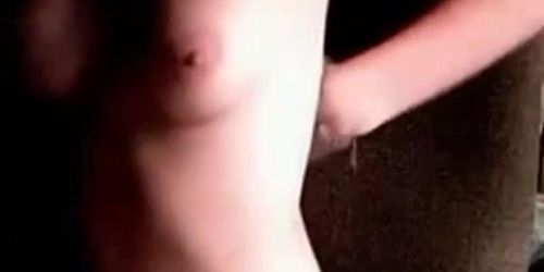 Modest cute and sexy redhead teases with her nice boobs on webcam