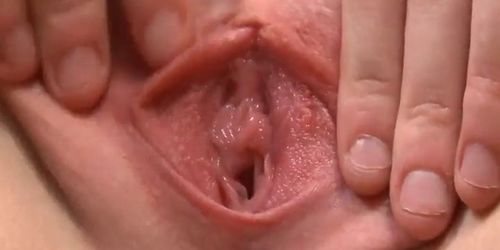 Lovely teenie is opening up wet snatch in closeup and getting off
