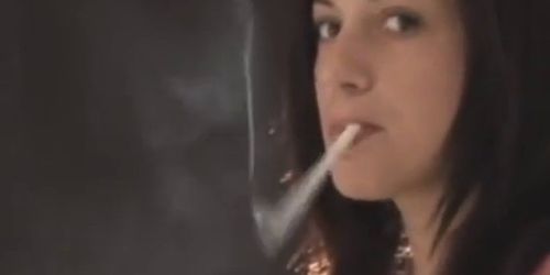 Sexy young brunette girl smoking & dangling