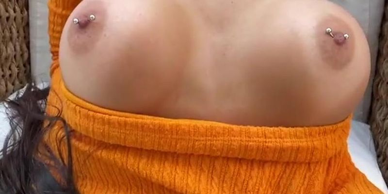 Latina is fingered by herself in a balcony