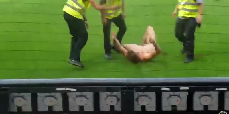 Nude maniac runs around the football field (Nestee Shy)