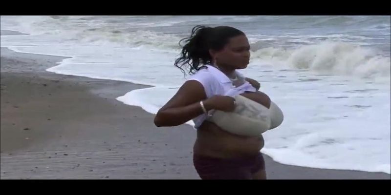 Miosotis flashes her big boobs in a bra at the beach